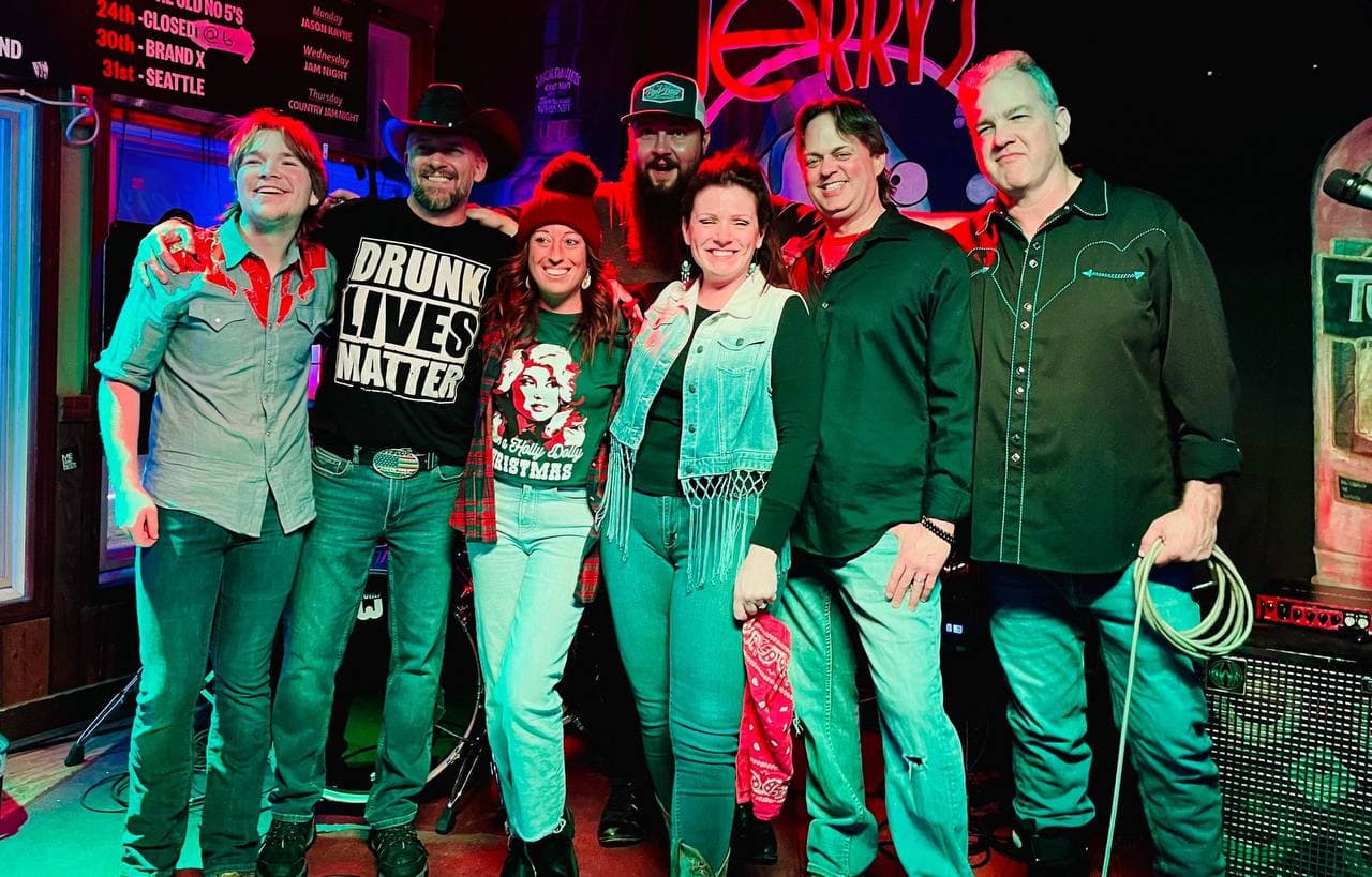 Country Jam musicians and friends gathered together onstage at Jerry’s Bait Shop